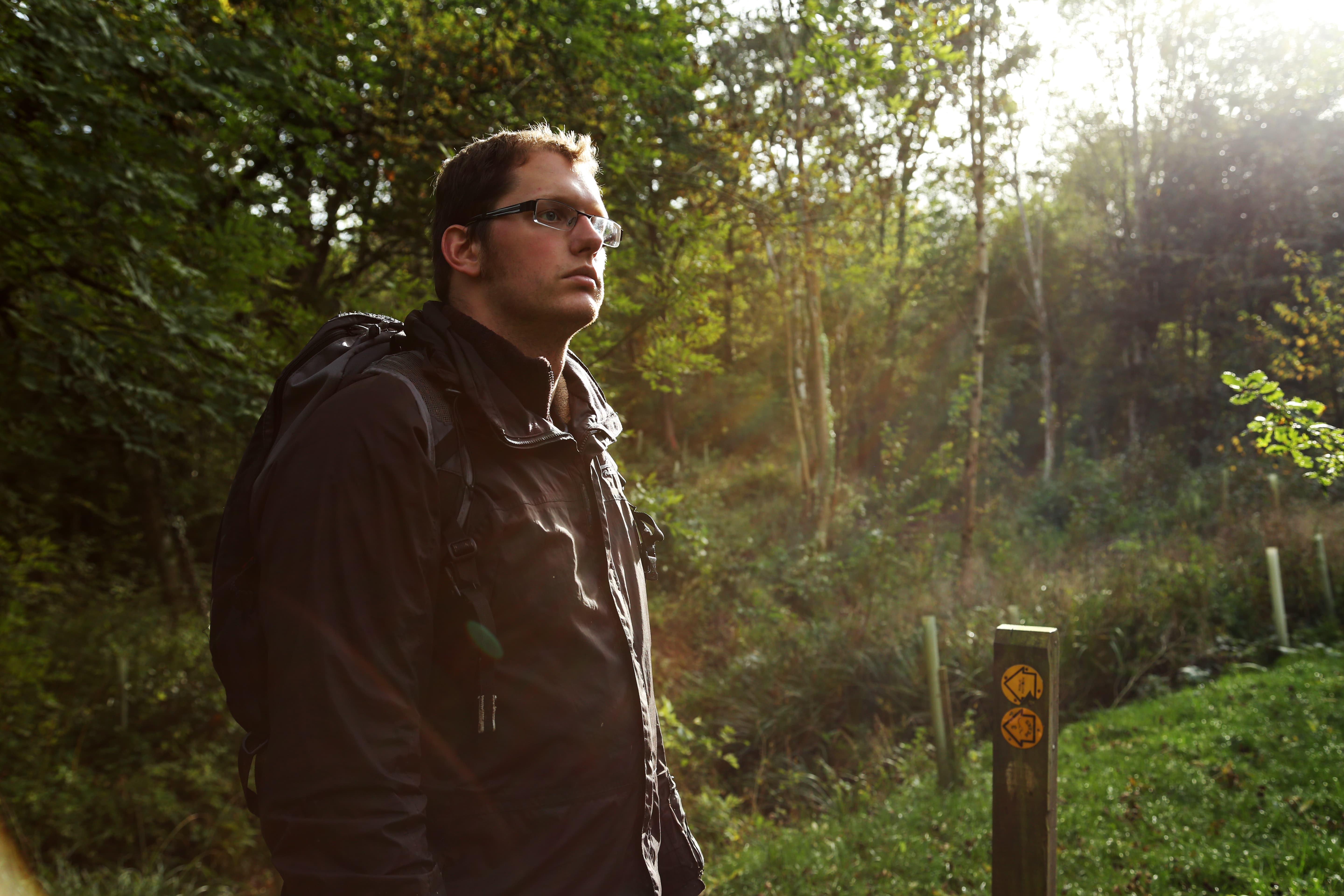 Drink M Oscar stands next to the lake